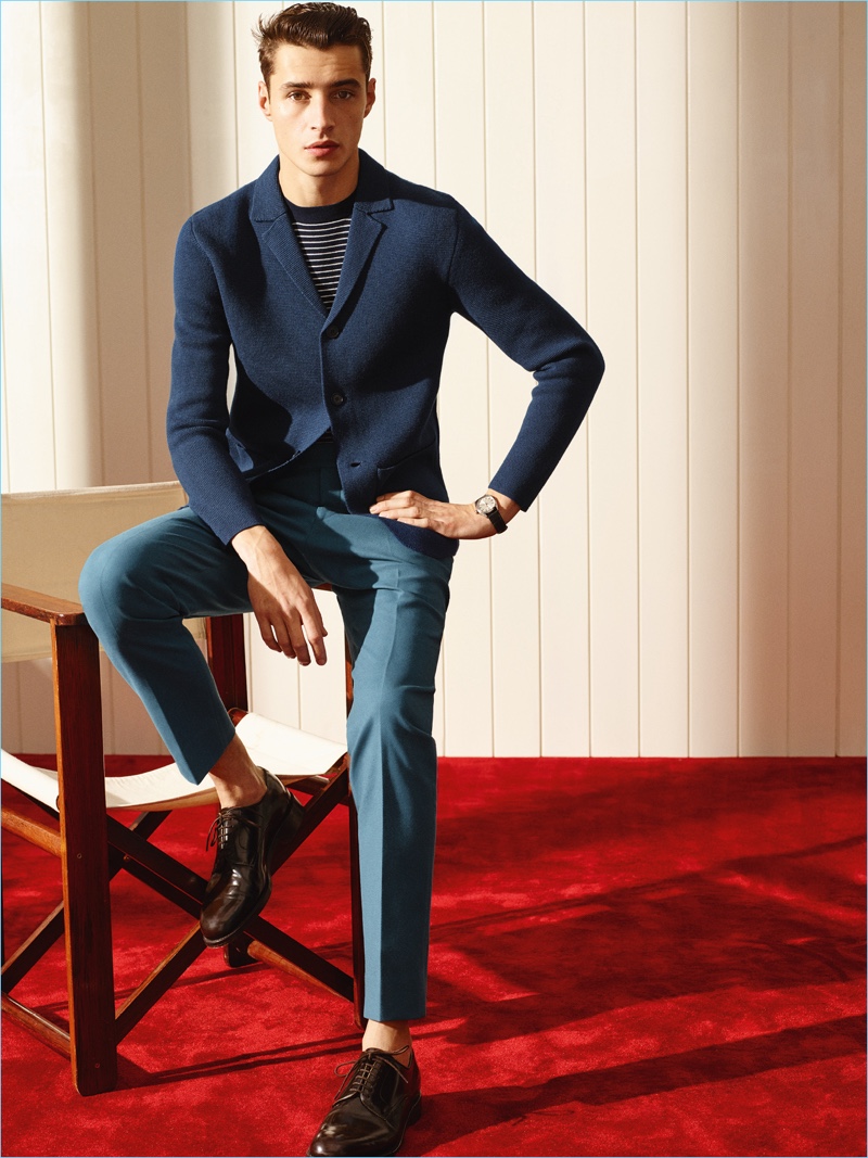 Model Adrien Sahores is chic in a knit blazer and slim pleated trousers from De Fursac.