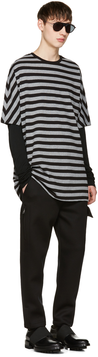 Tapping into 1990s style, SSENSE pairs Diesel Black Gold's striped t-shirt with a long-sleeve tee and black trousers.
