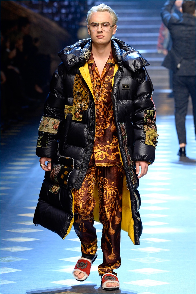 Brandon Thomas Lee sports a long puffer coat and silk pajamas by Dolce & Gabbana.