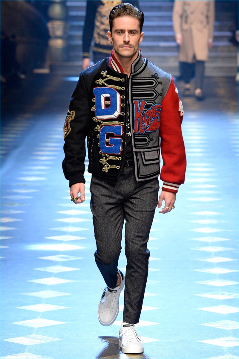 Pelayo Diaz rocks a band inspired varsity jacket from Dolce & Gabbana's fall-winter 2017 collection.