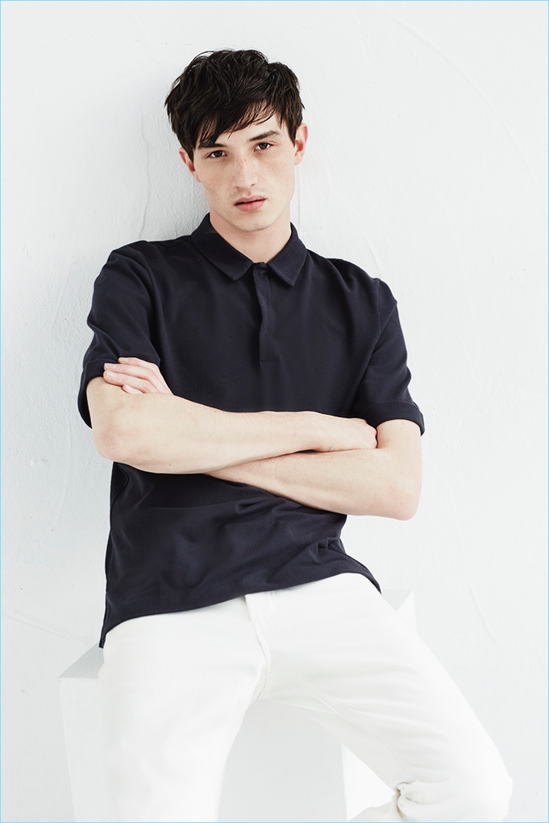 Jester White models an essential polo and white pants by ENLIST.