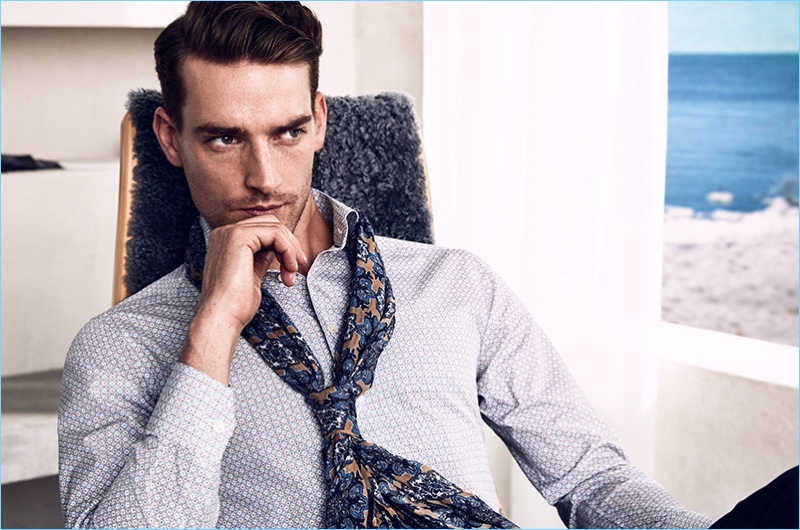 Playfully mixing patterns, Eton showcases its printed poplin shirt and patterned scarf.