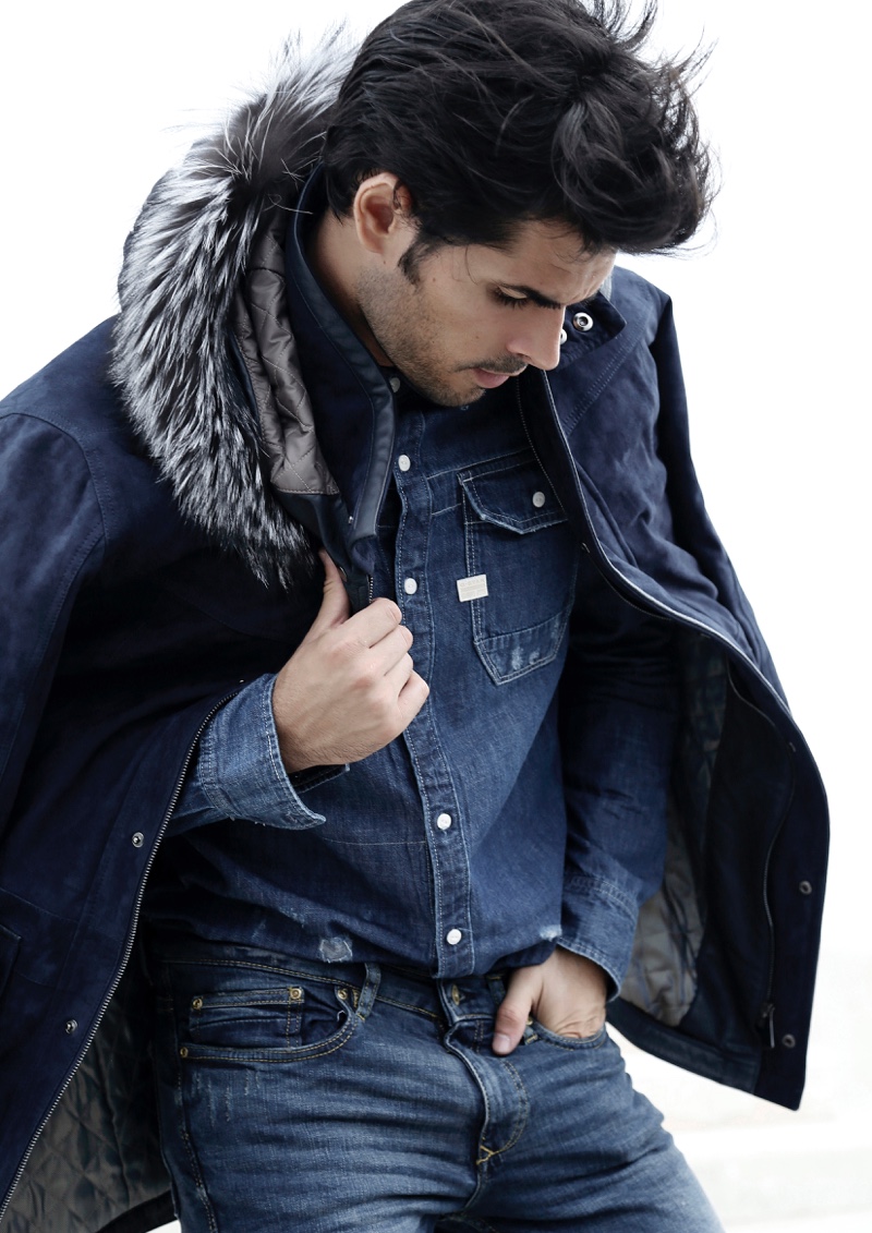 Raul wears denim shirt G-Star Raw, jeans GUESS, and jacket Torras.