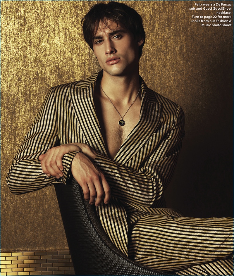 A striking vision, Felix Cordier dons a De Fursac striped suit with a Gucci necklace.
