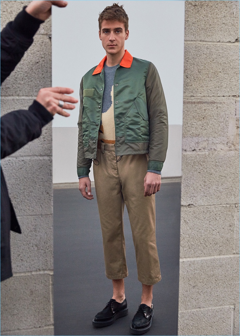 Samuel Roberts wears a Ganryu jacket with a 3.1 Phillip Lim sweater, Stussy cropped trousers, and Comme des Garçons Homme Plus pony hair shoes.