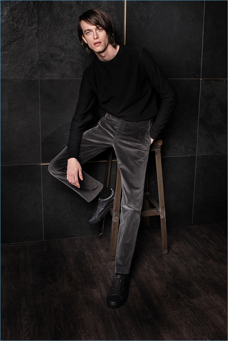 Australian model Reuben Ramacher dons a grey pair of trousers from Hiltl's fall-winter 2017 collection.