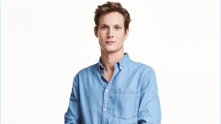 Model Felix Gesnouin sports a light blue denim shirt from H&M.