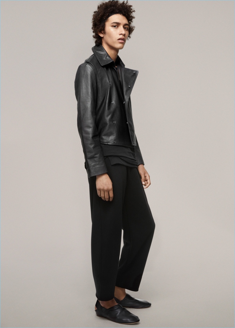 Clad in black, Jackson Hale wears a leather jacket and relaxed trousers from H&M Studio's spring-summer 2017 men's collection.