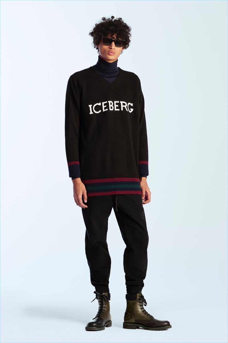 Model Malik Jalloh sports a knit with an Iceberg logo from the brand's fall-winter 2017 men's collection.