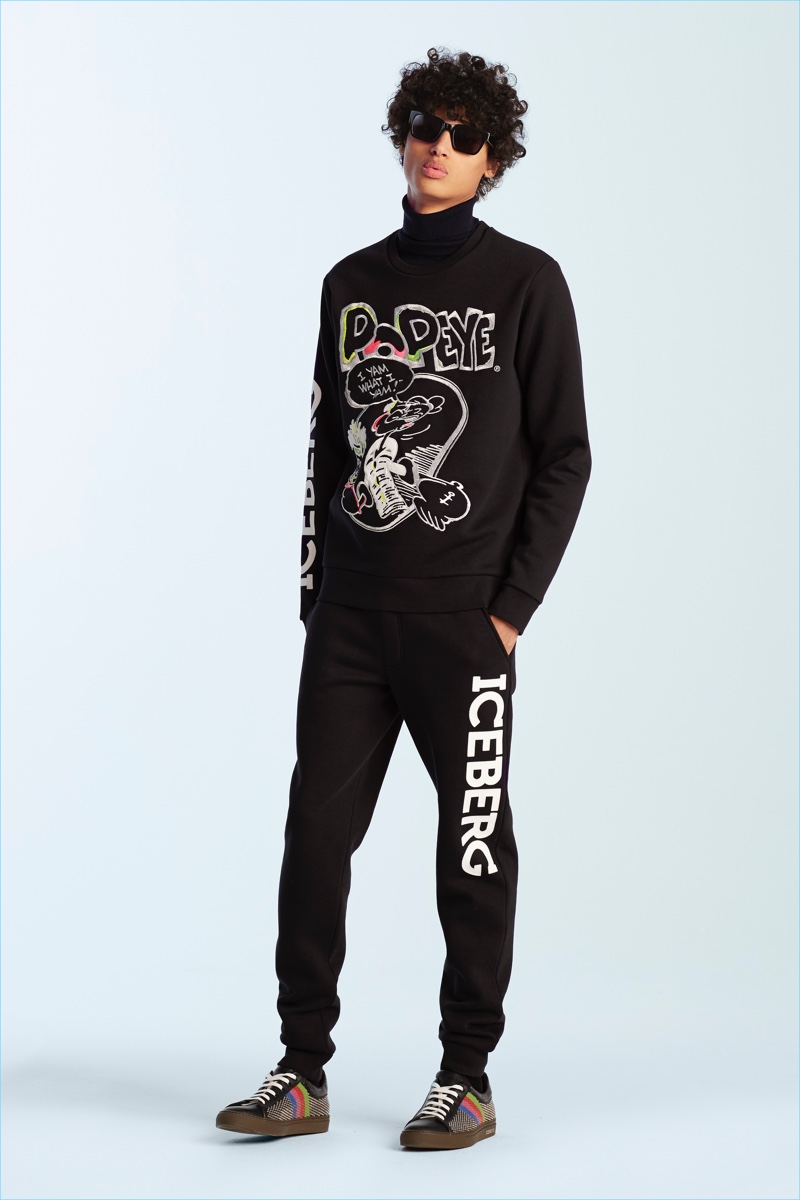 Malik Jalloh rocks a sweatshirt from Iceberg featuring a Popeye graphic.