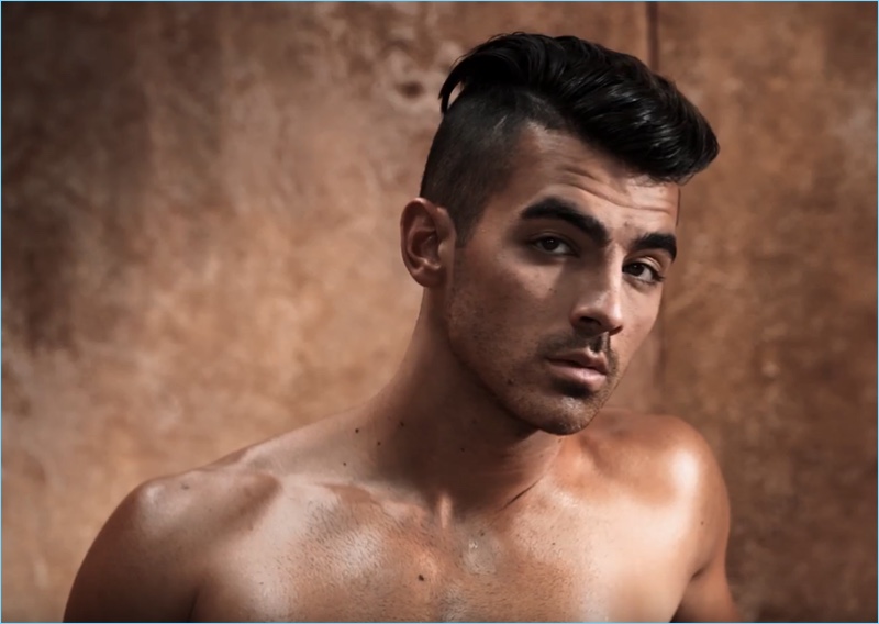 Channeling his inner model, Joe Jonas appears in a video still for his GUESS Underwear campaign.