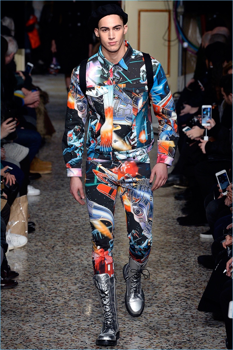 Alessio Pozzi takes to the catwalk in a graphic ensemble featuring an all-over Transformers print. » Moschino Does Combat Style for Fall '17 Collection Alessio Pozzi takes to the catwalk in a graphic ensemble featuring an all-over Transformers print.