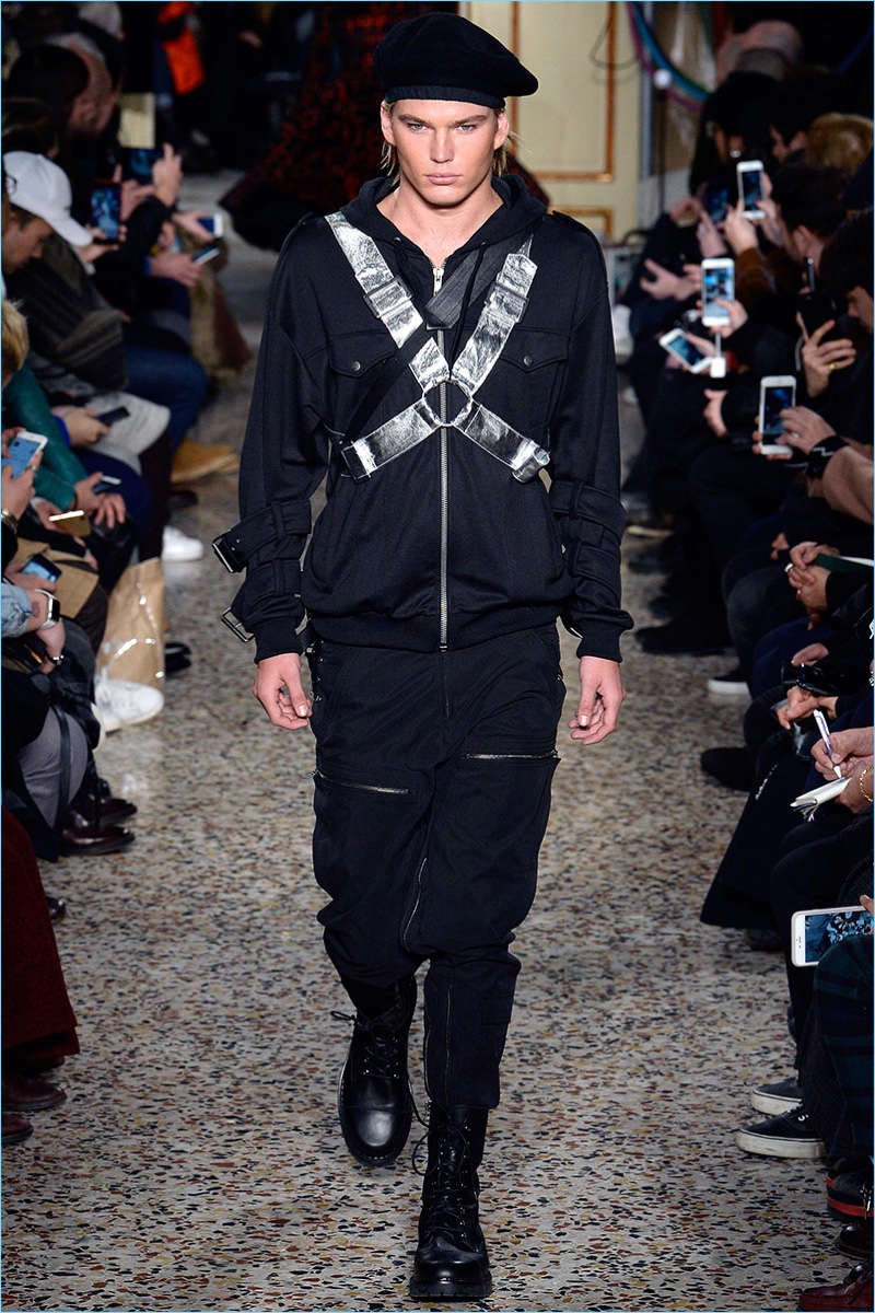 Jordan Barrett takes a combative stroll down the Marni catwalk in a harness.