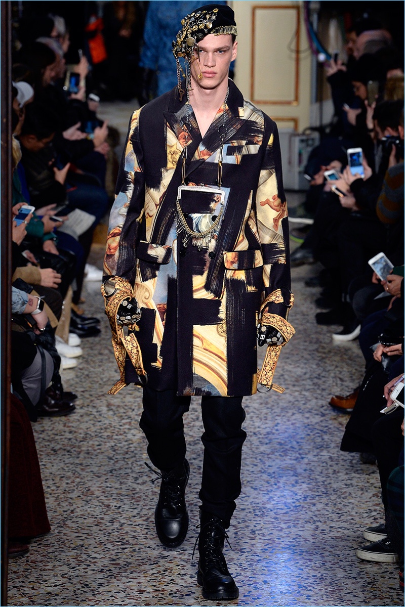 Filip Hrivnak walks the runway in a bold graphic number from Moschino's fall-winter 2017 men's collection. » Moschino Does Combat Style for Fall '17 Collection Filip Hrivnak walks the runway in a bold graphic number from Moschino's fall-winter 2017 men's collection.