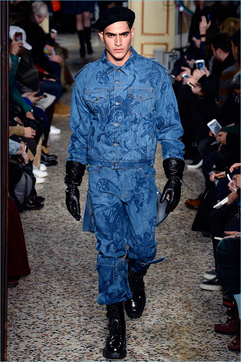 Jhon Burjack sports a double denim ensemble from Moschino's fall-winter 2017 men's collection.