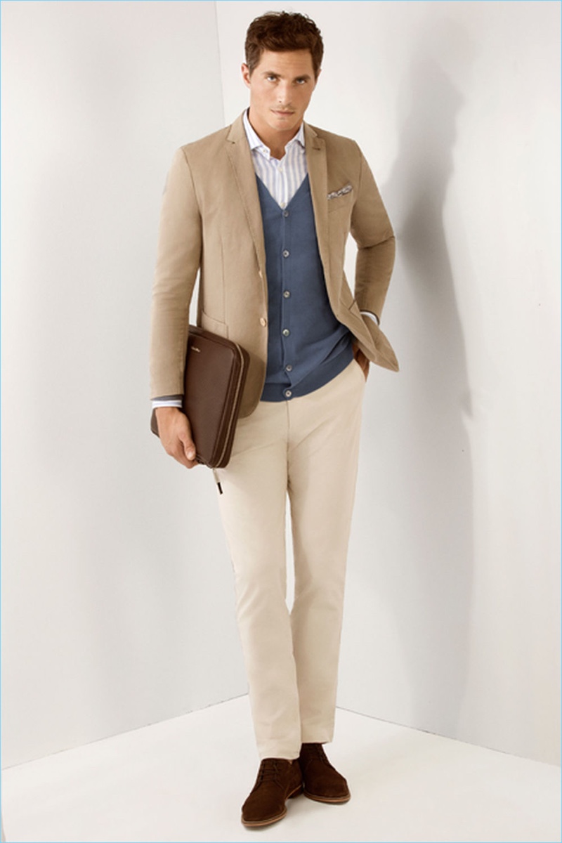 English model Ollie Edwards embraces neutrals with a sport coat and chinos by Pedro del Hierro.