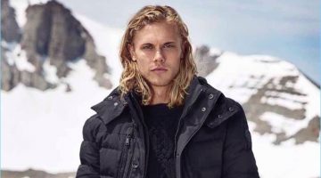 Winter Sale: Tackle Polo Ralph Lauren's Classic Wardrobe Essentials Christopher Mason models a navy down jacket from Polo Ralph Lauren.