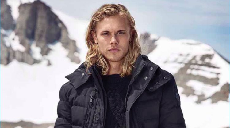 Christopher Mason models a navy down jacket from Polo Ralph Lauren.