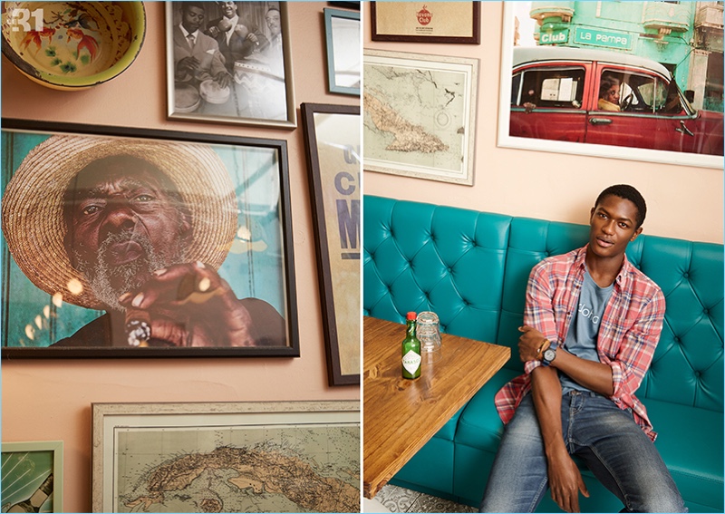 Hamid Onifade goes casual in a plaid flannel shirt, aloha t-shirt, and distressed denim jeans by LE 31.