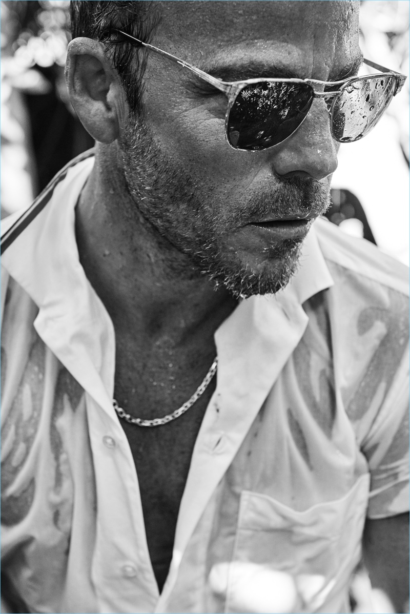 A cool vision, Stephen Dorff rocks Ray-Ban sunglasses with a wet Hugo Boss shirt.
