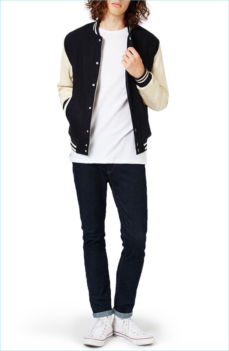 Nordstrom styles Topman's varsity bomber jacket with a simple tee, skinny jeans, and white sneakers.