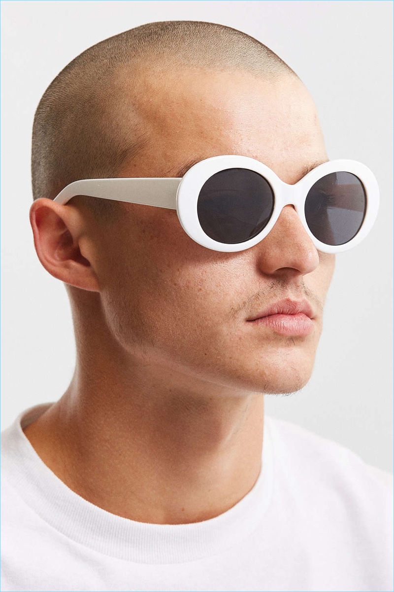Kurt Cobain vibe sunglasses offering thick plastic frames in a rounded silhouette. Tinted lenses are 100% UV-protected. Complete with curved plastic arms + a molded nose bridge for a comfortable wear.