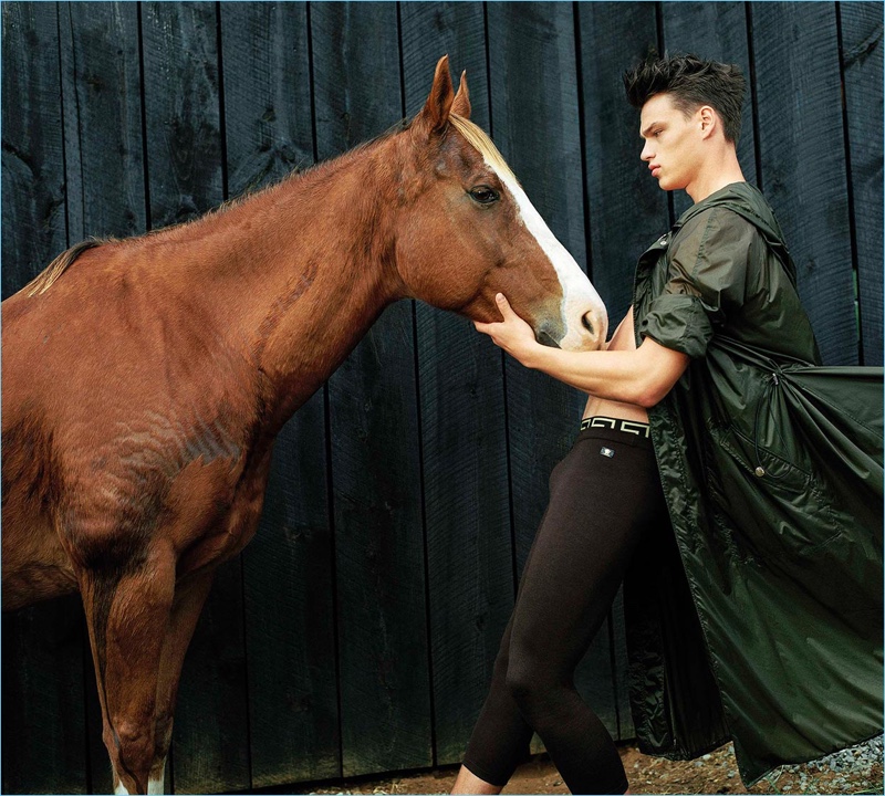 Filip Hrivnak poses with a horse for Versace's spring-summer 2017 men's campaign.