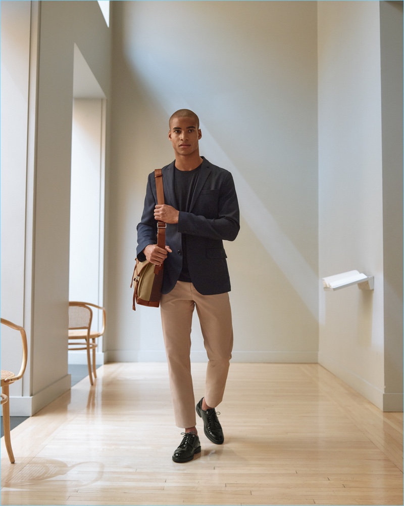 A smart vision, Malik Lindo sports WANT Les Essentiels' messenger bag and dress shoes.