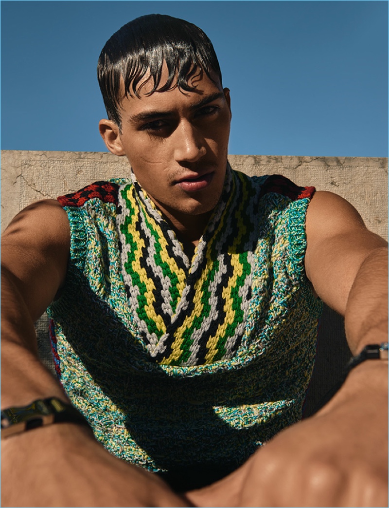 Alessio Pozzi wears a quirky sleeveless sweater from Italian fashion house, Prada.