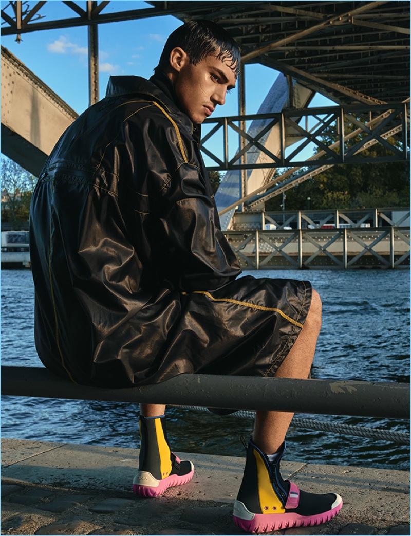 Italian model Alessio Pozzi embraces a moody moment in a spring look from Prada.