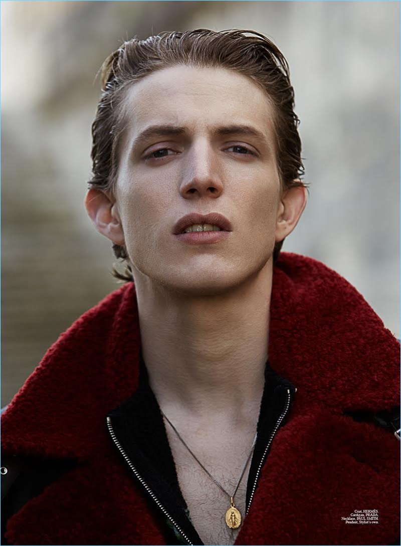 Xavier Buestel wears a Hermes coat, Prada cardigan, and Paul Smith necklace for Summerwinter magazine.