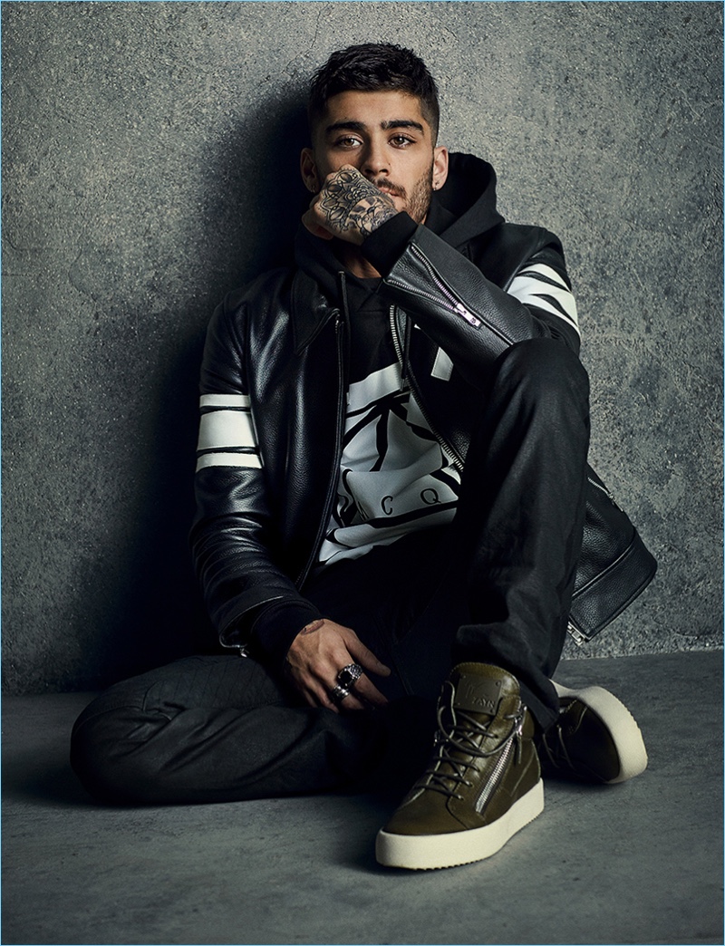 Zayn Malik goes casual in a black leather jacket and slim pants, wearing his Giuseppe Zanotti Taz sneakers.