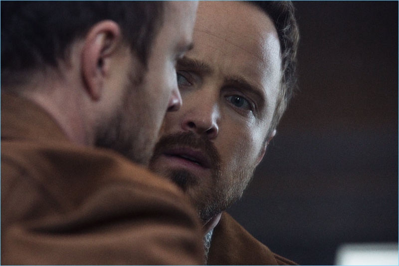 Actor Aaron Paul dons a brown jacket by Sandro.