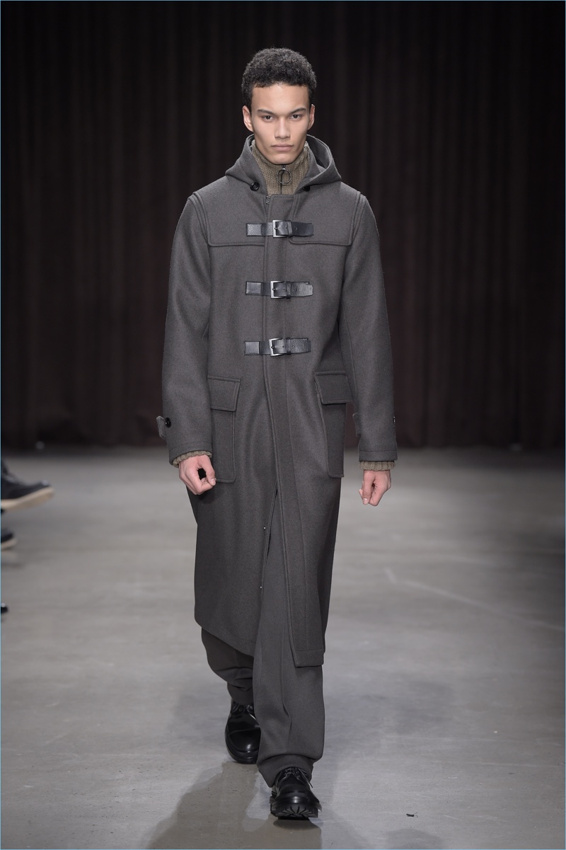 Buckles also adorn a long duffle coat from BOSS Hugo Boss' fall-winter 2017 men's collection.