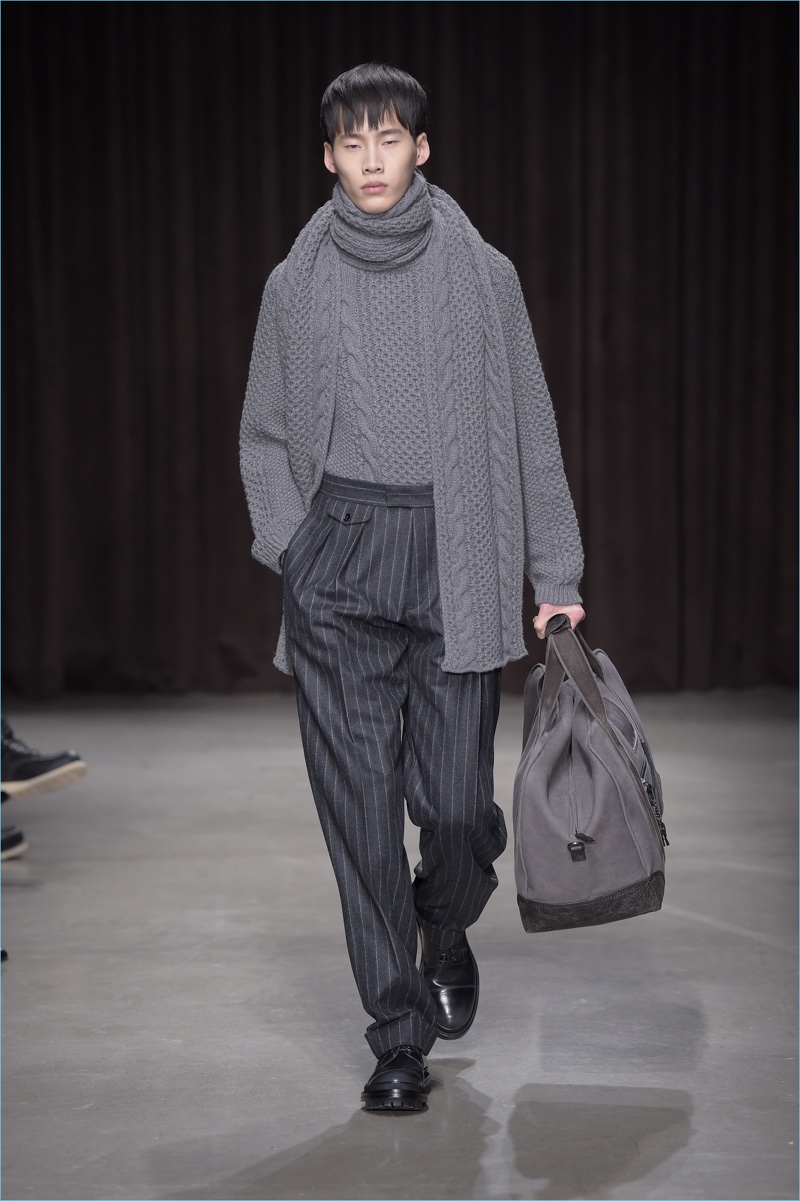 German brand BOSS Hugo Boss produces a cable-knit sweater with a matching scarf for fall-winter 2017.