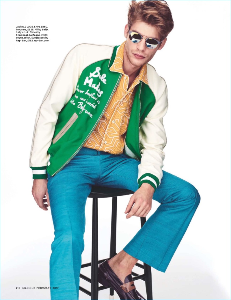 Tapping into a cool retro theme, Baptiste Radufe wears a Bally shirt, jacket, and trousers with Ray-Ban sunglasses. The French model also sports Ermenegildo Zegna leather loafers.