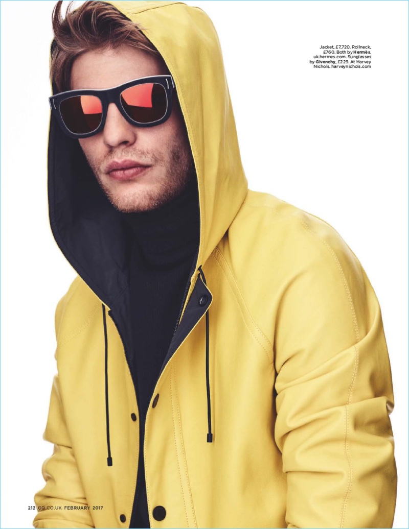 Baptiste Radufe makes a bold statement in a yellow hooded Hermes jacket with Givenchy sunglasses.