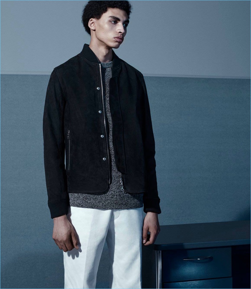 The bomber jacket is front and center as Sol wears one from Officine Generale with a Barneys New York sweater and Dries Van Noten trousers.
