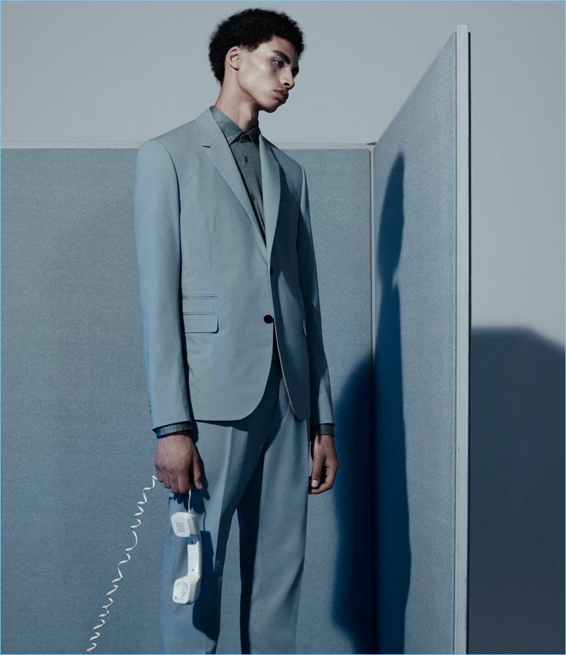 Sol Goss dons a Valentino suit with a Luciano Barbera shirt.