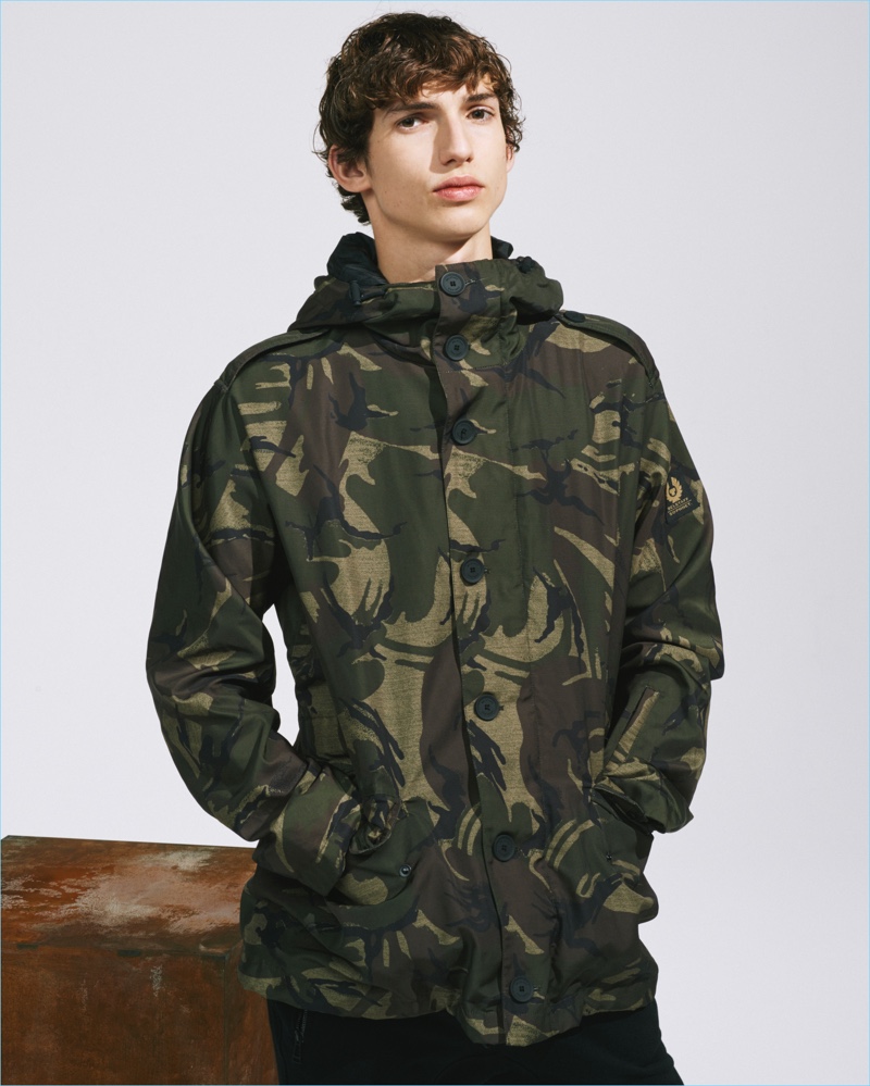 A parka embraces an all-over camouflage print for Belstaff's SOPHNET collaboration.