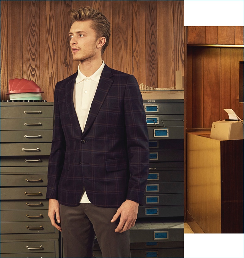 Max Rendell gravitates towards separates with a plaid sport coat, white polo, and slim-fit chinos from Paul Smith.