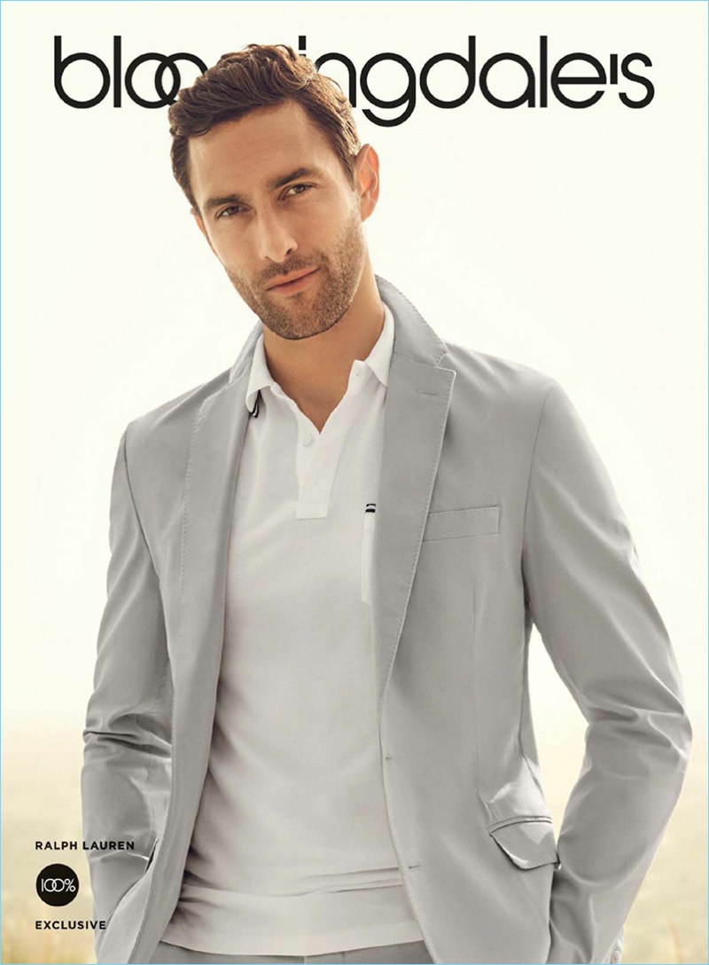Noah Mills dons a grey sport coat and polo from Ralph Lauren for Bloomingdale's spring 2017 campaign.