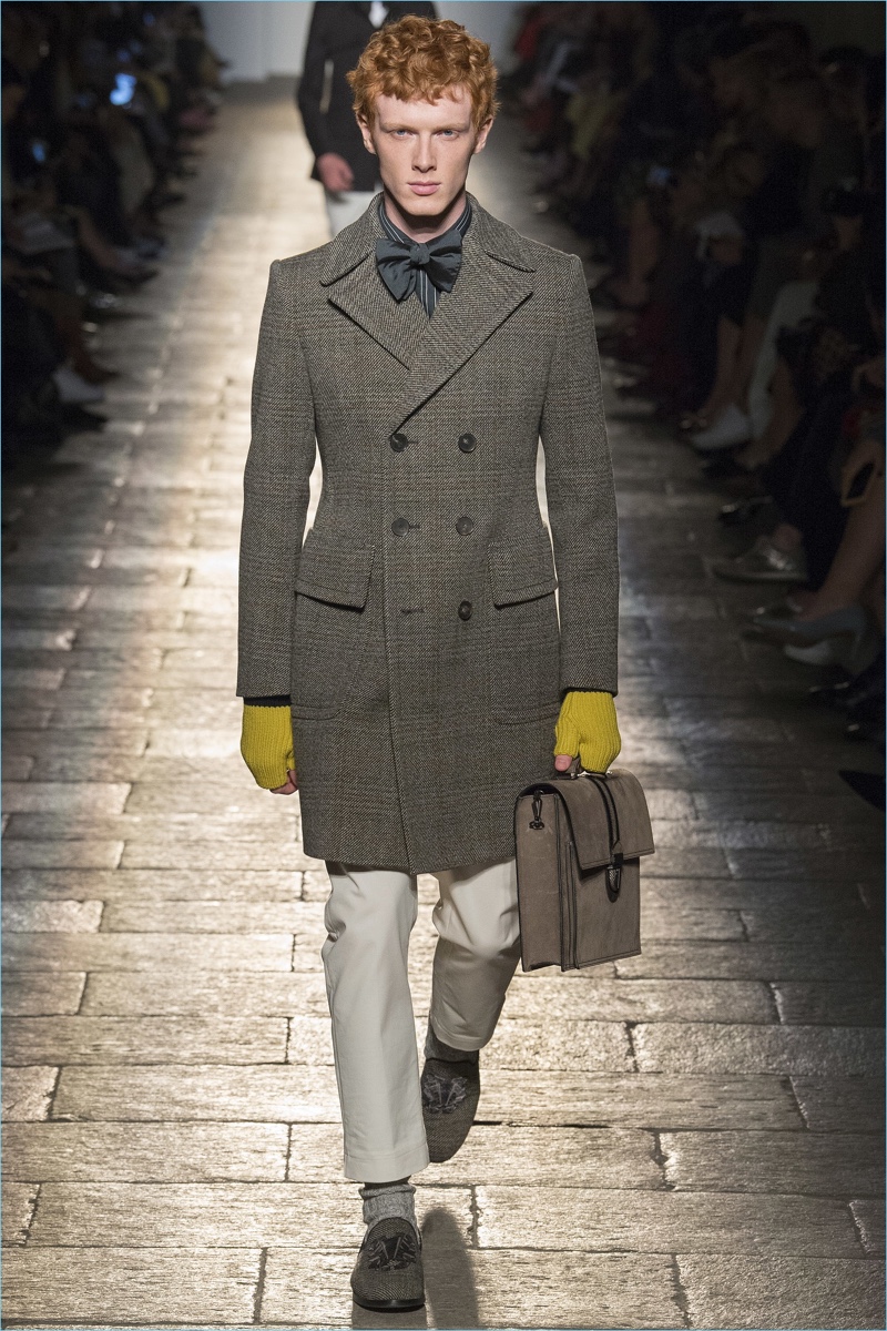 Sharp tailoring and bow-ties signify a dandy collection from Bottega Veneta.