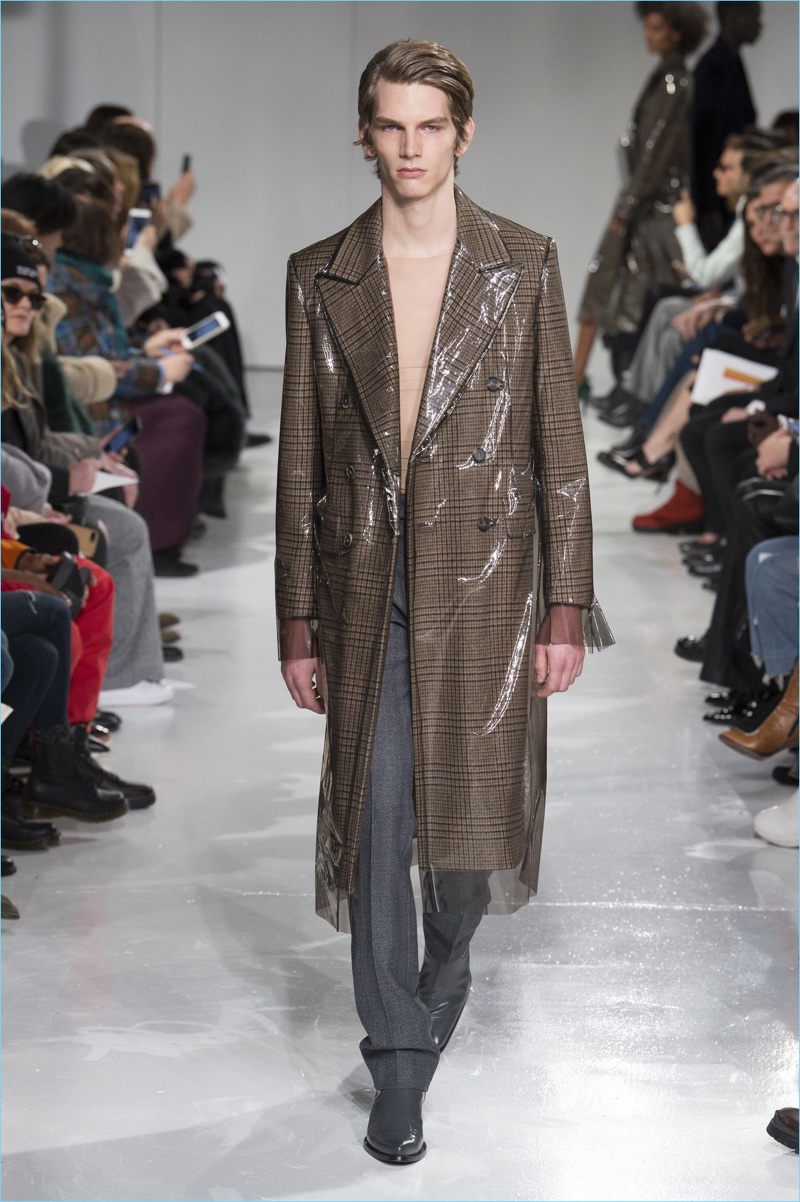 A plastic cover disrupts traditional tailoring for Calvin Klein Collection's fall-winter 2017 offering.