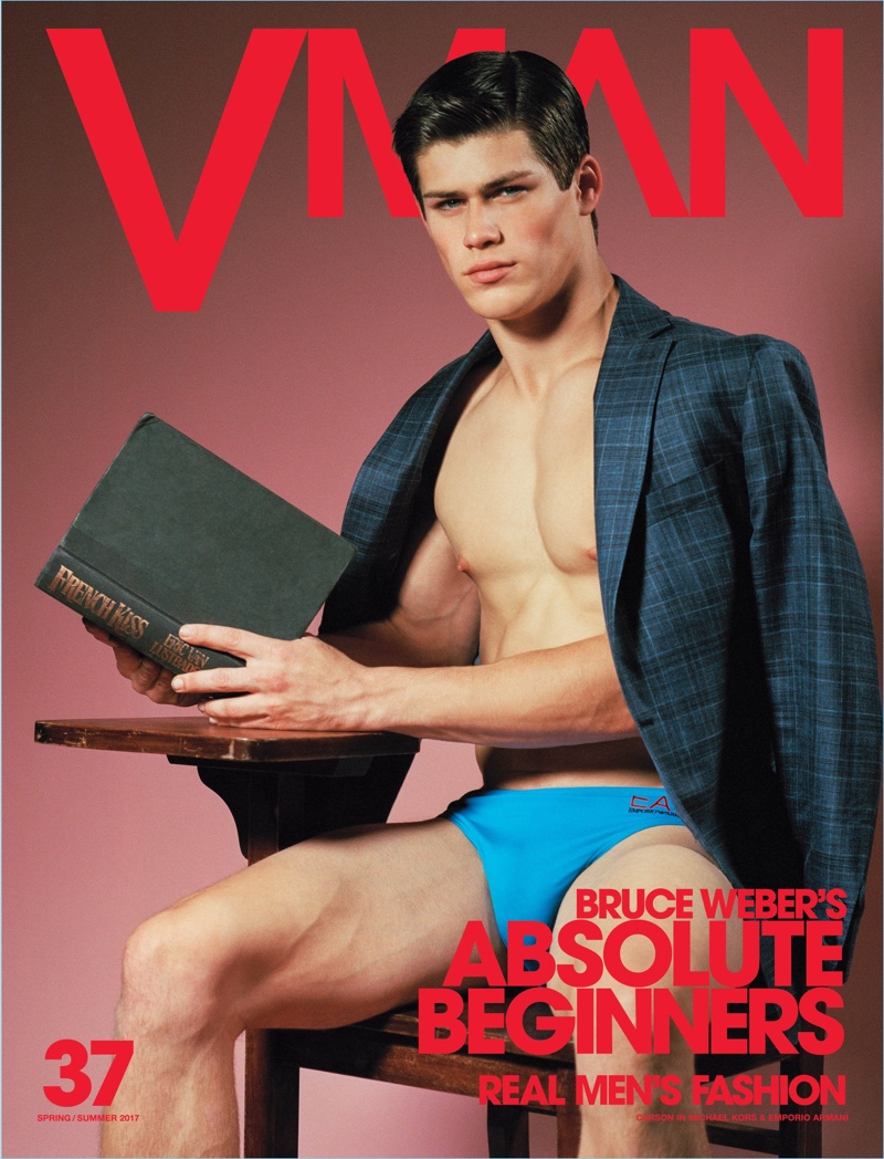 Carson Aldridge wears an EA7 swimsuit for the cover of VMAN.