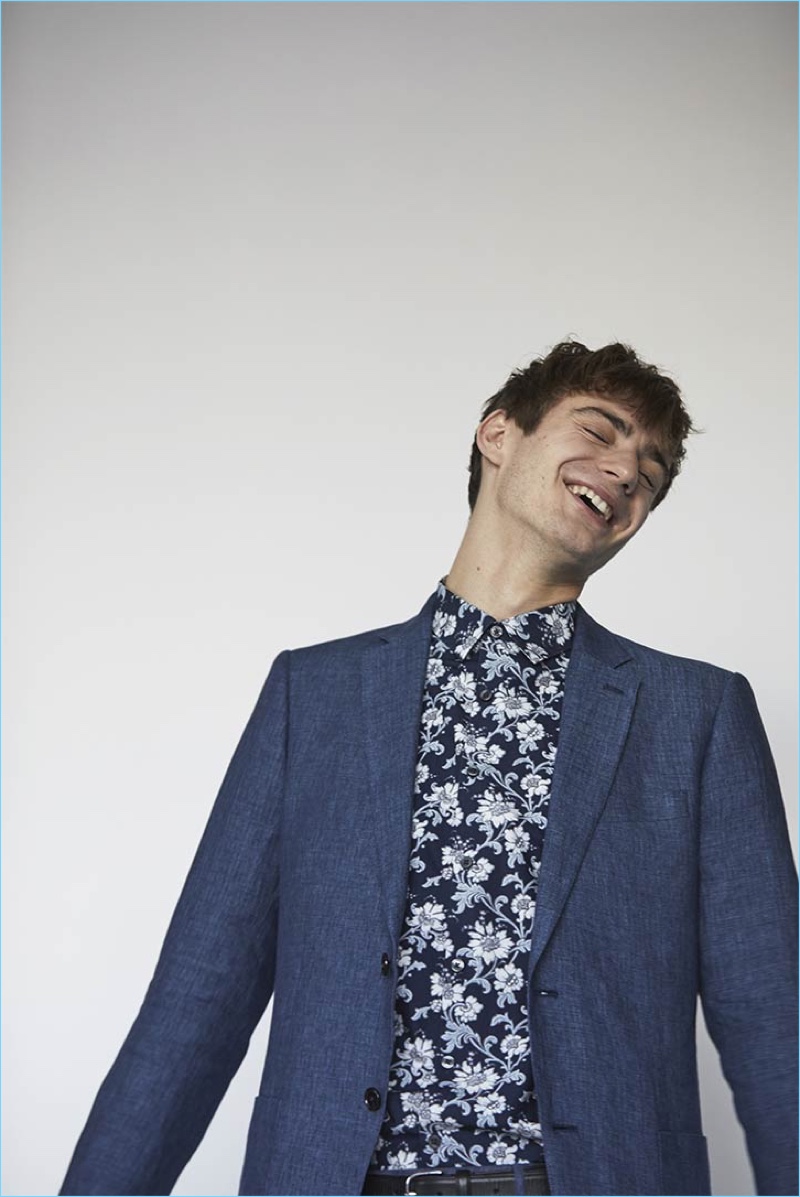 All smiles, Ben Allen sports a floral print shirt and blue blazer for Club Monaco's spring-summer 2017 campaign.