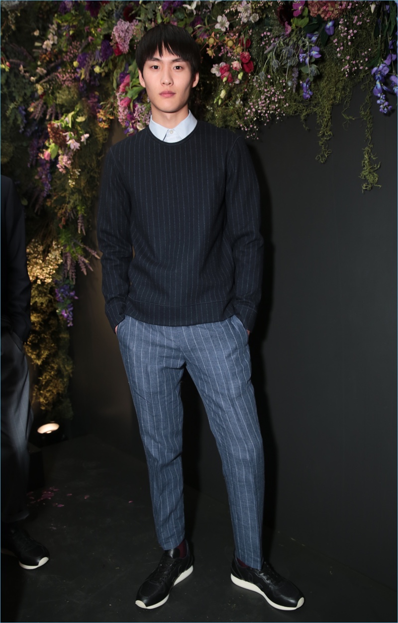 Club Monaco offers a fresh spin on pinstripes with a pullover and trousers.