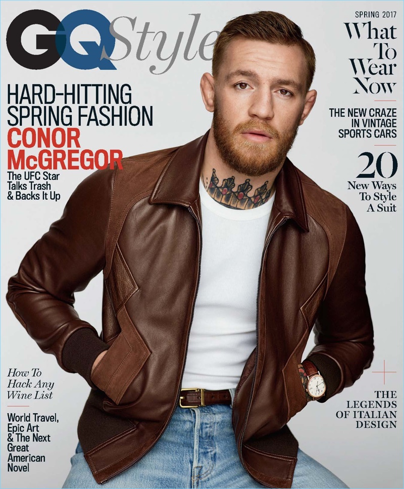 Conor McGregor covers the spring 2017 issue of GQ Style. McGregor sports a brown leather jacket by Neil Barrett with a shirt and belt by Dolce & Gabbana. The UFC star also wears Levi's jeans and a Breguet watch.