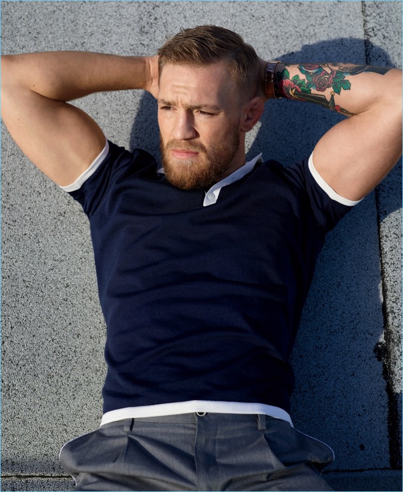 Embracing a fitted look, Conor McGregor sports a Berluti polo with Dolce & Gabbana trousers.