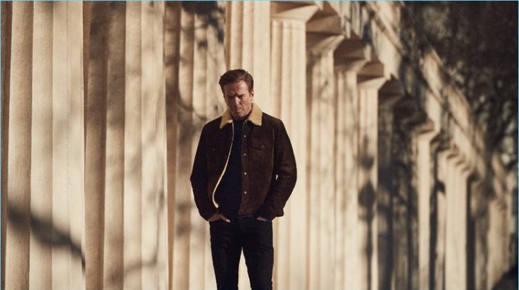 Damian Lewis wears a Tom Ford shearling-trimmed suede jacket with a Tod's sweater and Acne Studios jeans.
